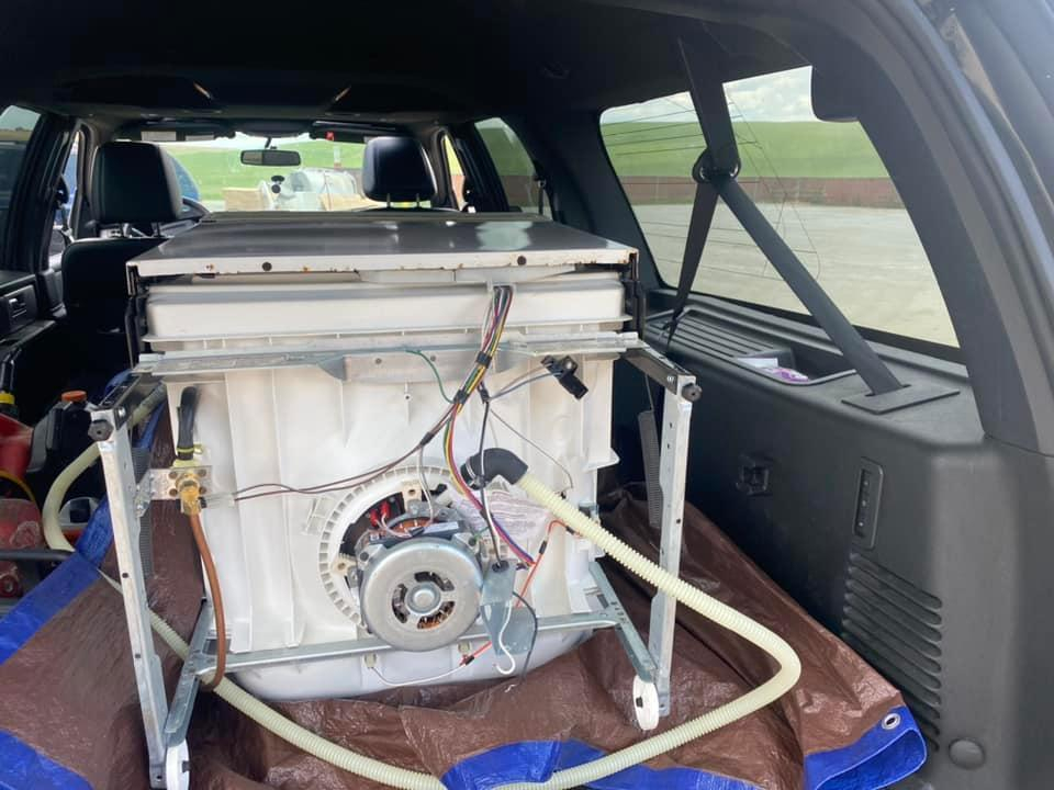 In removing the dishwasher to a new location, you should cover the surface of the car with waterproof material.