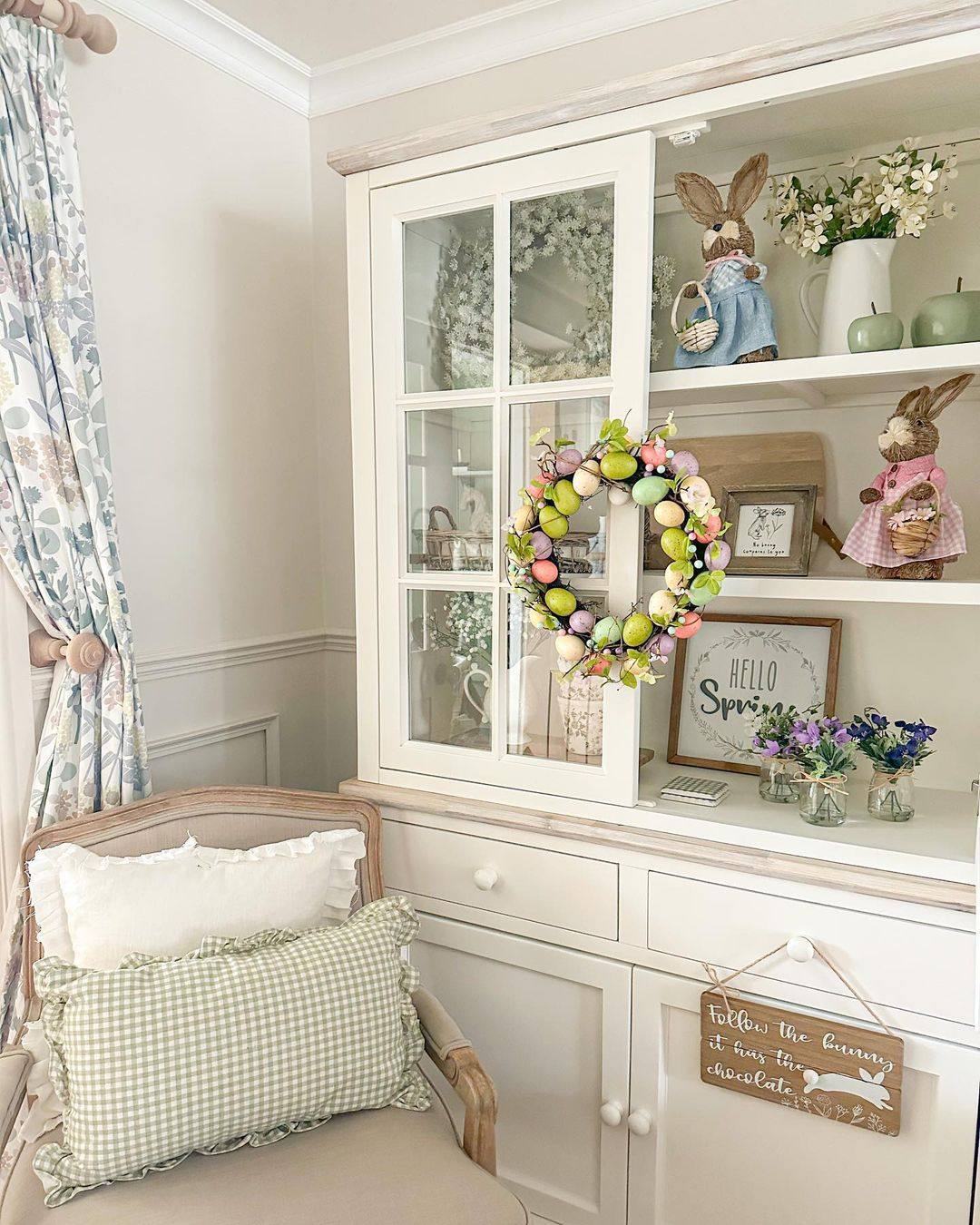 This reading nook is located in the corner of the living room near the window.
