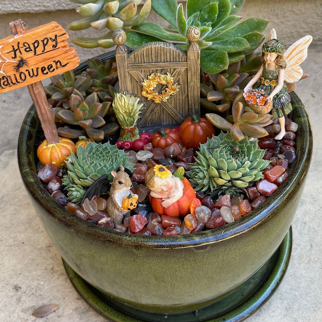 There is a garden sign in this fairy garden that mentions the Halloween sign. 