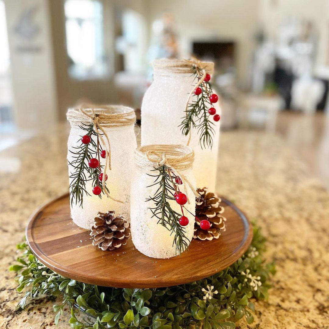 This one is a seasonal candle holder (winter) with the snow effect on the surface of the jar, evergreen, and pinecones added near the jar.