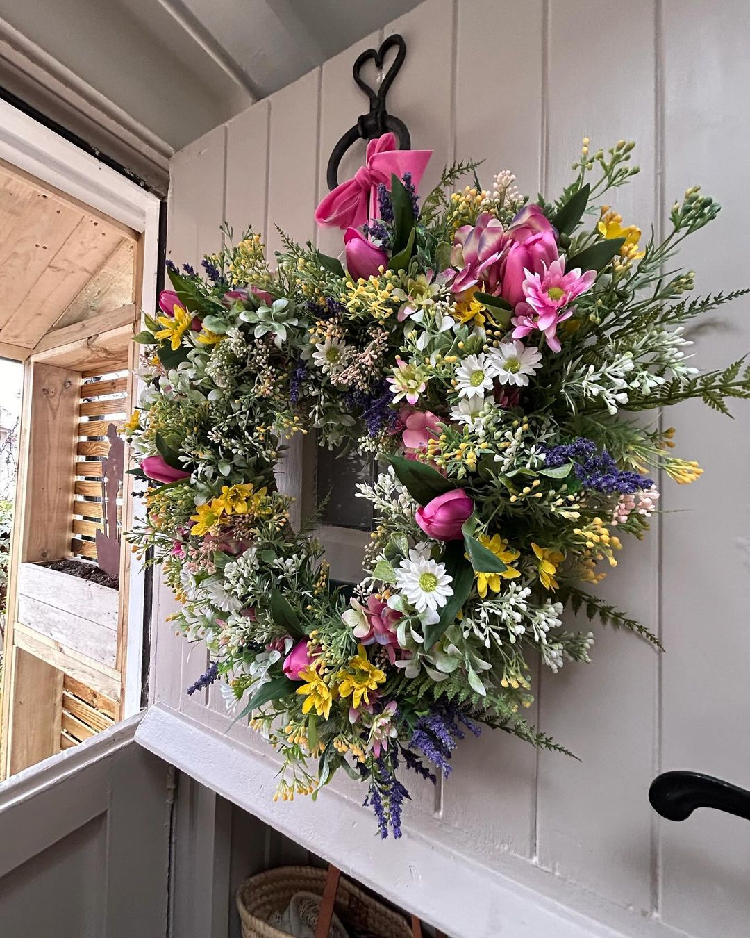This wreath is made with varied kinds of flowers. The colors are also varied and the sizes are different from one to another.