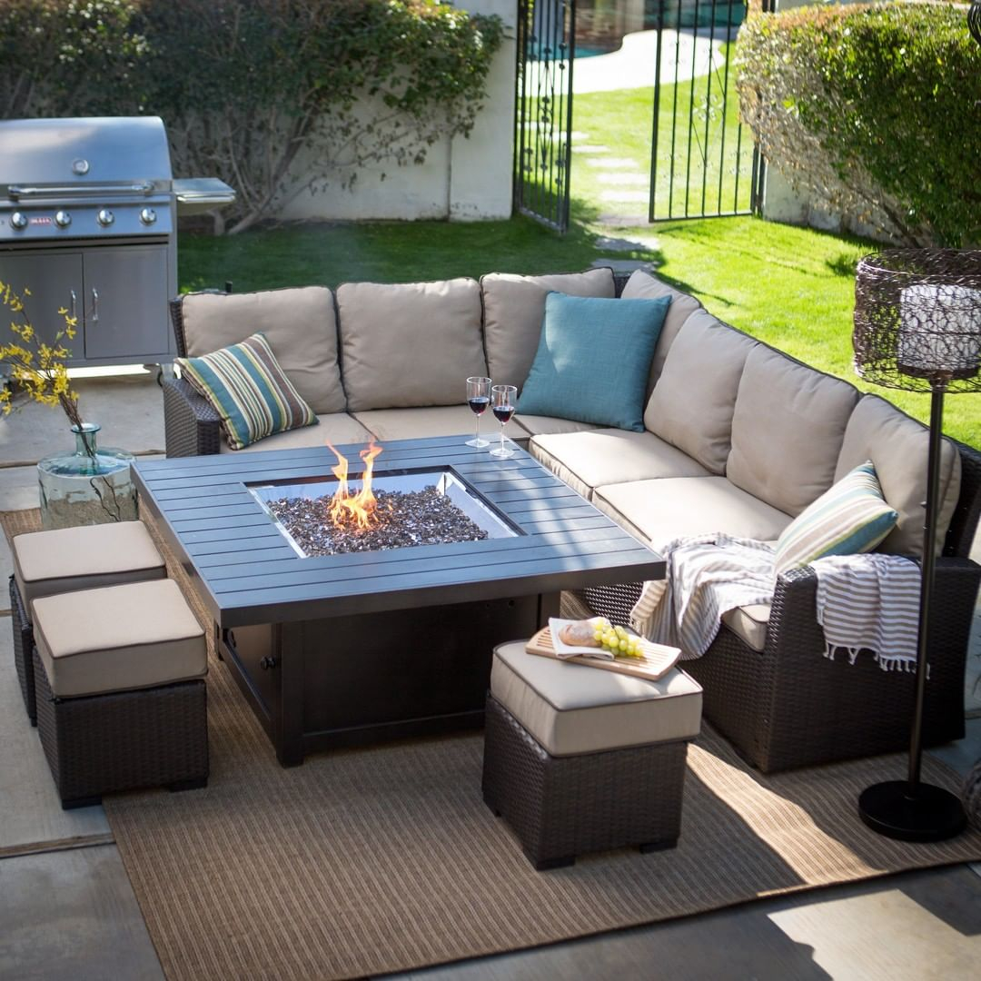 This outdoor living room looks cozy with the comfortable sofa.