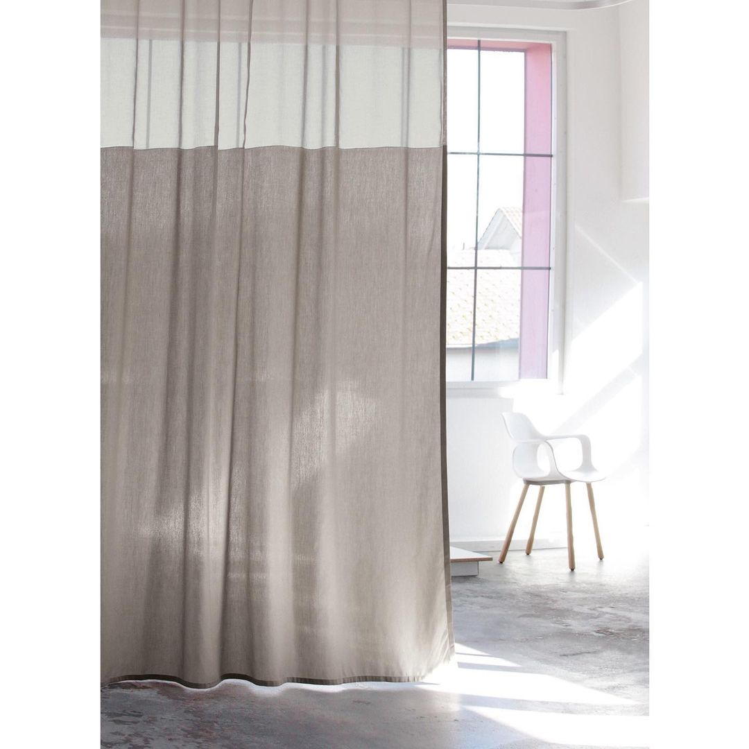 Look at how the voile material can be such a great room divider. It can be a room divider without blocking the light. 