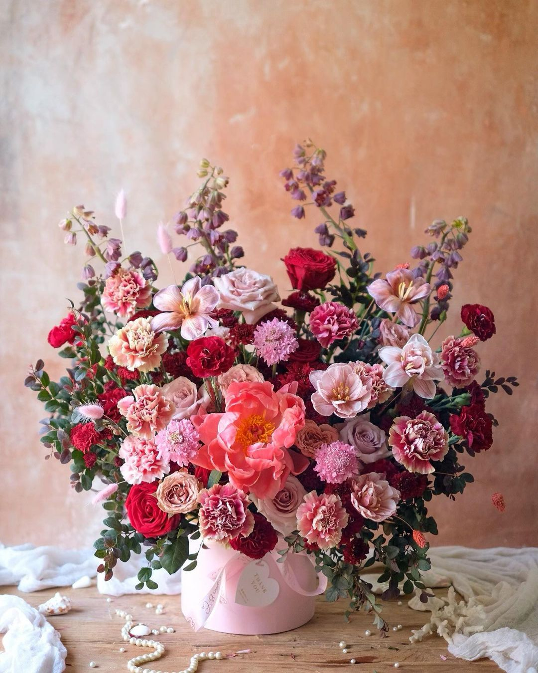 There are different shades of pink color with some gradation that make the flower arrangement look adorable.