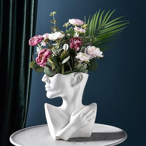 This one is an abstract vase shaped which is really artistic. It can't be doubted how it can be your home's additional ornament.