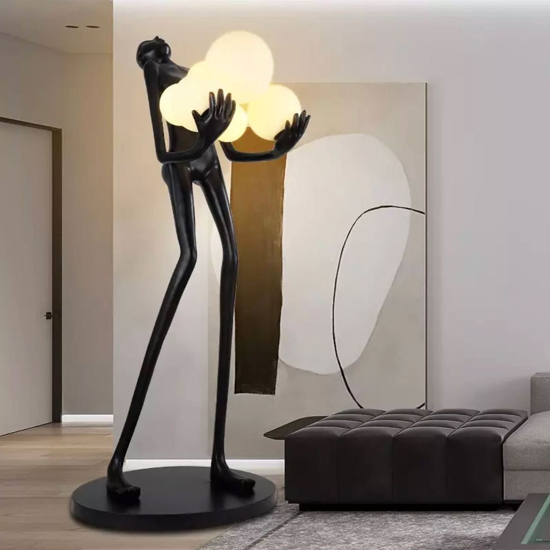 This one is a human body sculpture with ball lamps on the hand. It can be such a great one for the beauty of your house.