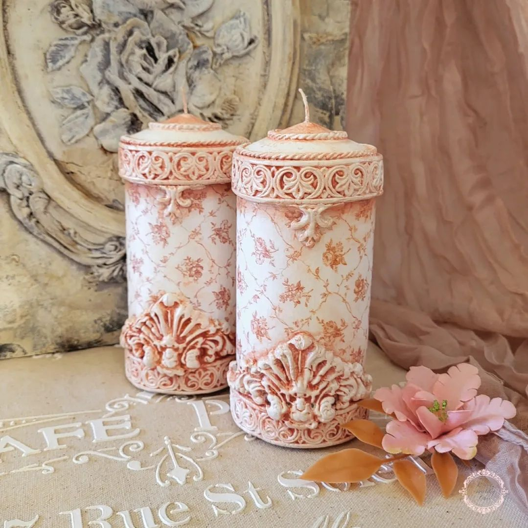 Look at how pretty and aesthetic these two candles are. They have a shabby chic style in peach color and detailed carving.