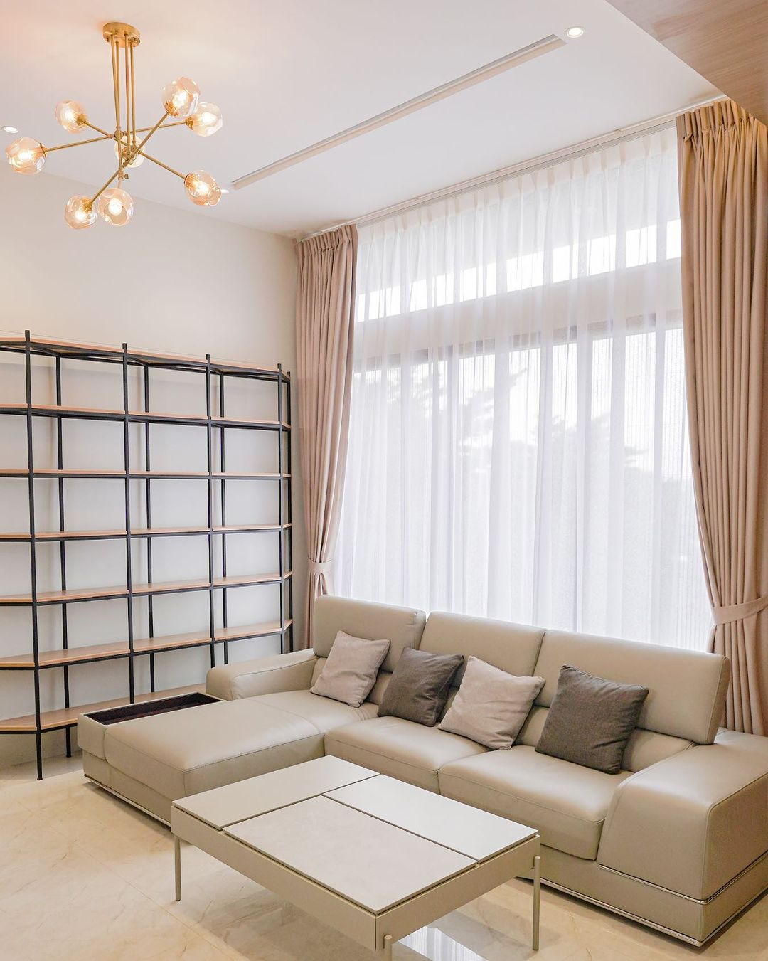 This living room uses the lightweight curtain as the first layer that will let the natural sunlight enter the room.