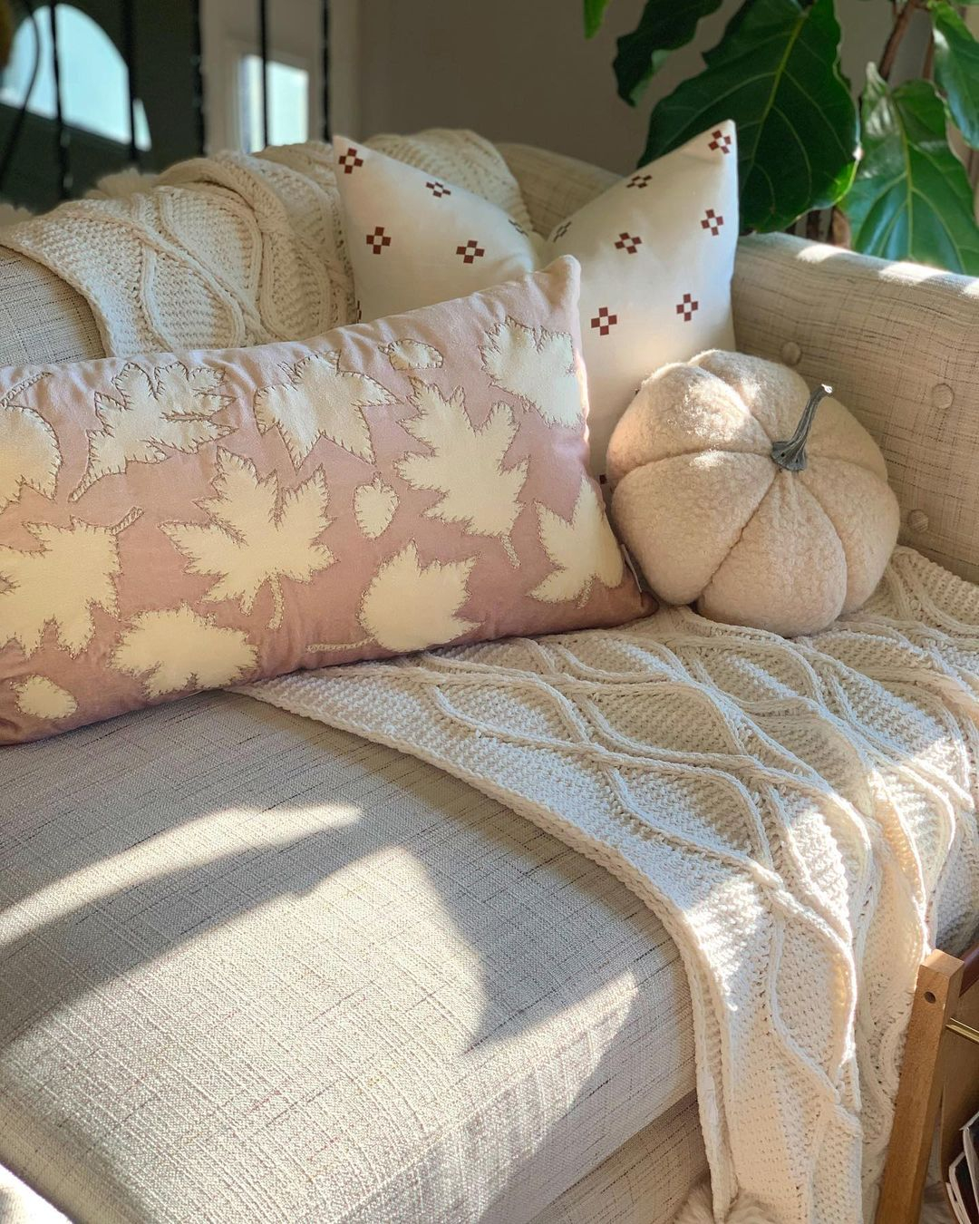 Fall leaf-patterned throw pillow