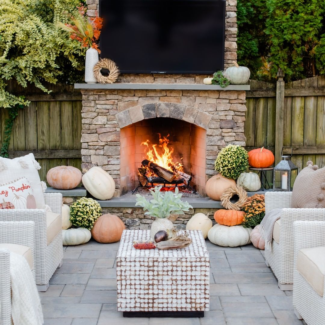 Outdoor fireplace with pumpkins