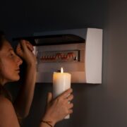 Side-view-woman-checking-electrical-panel_23-2149477442